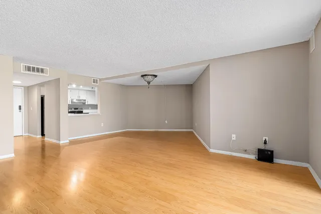 a kitchen with a sink and stainless steel appliances
