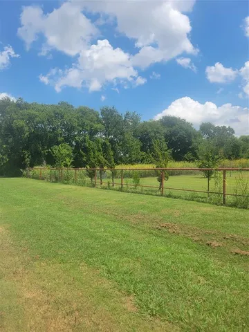 a view of a golf course with a lake