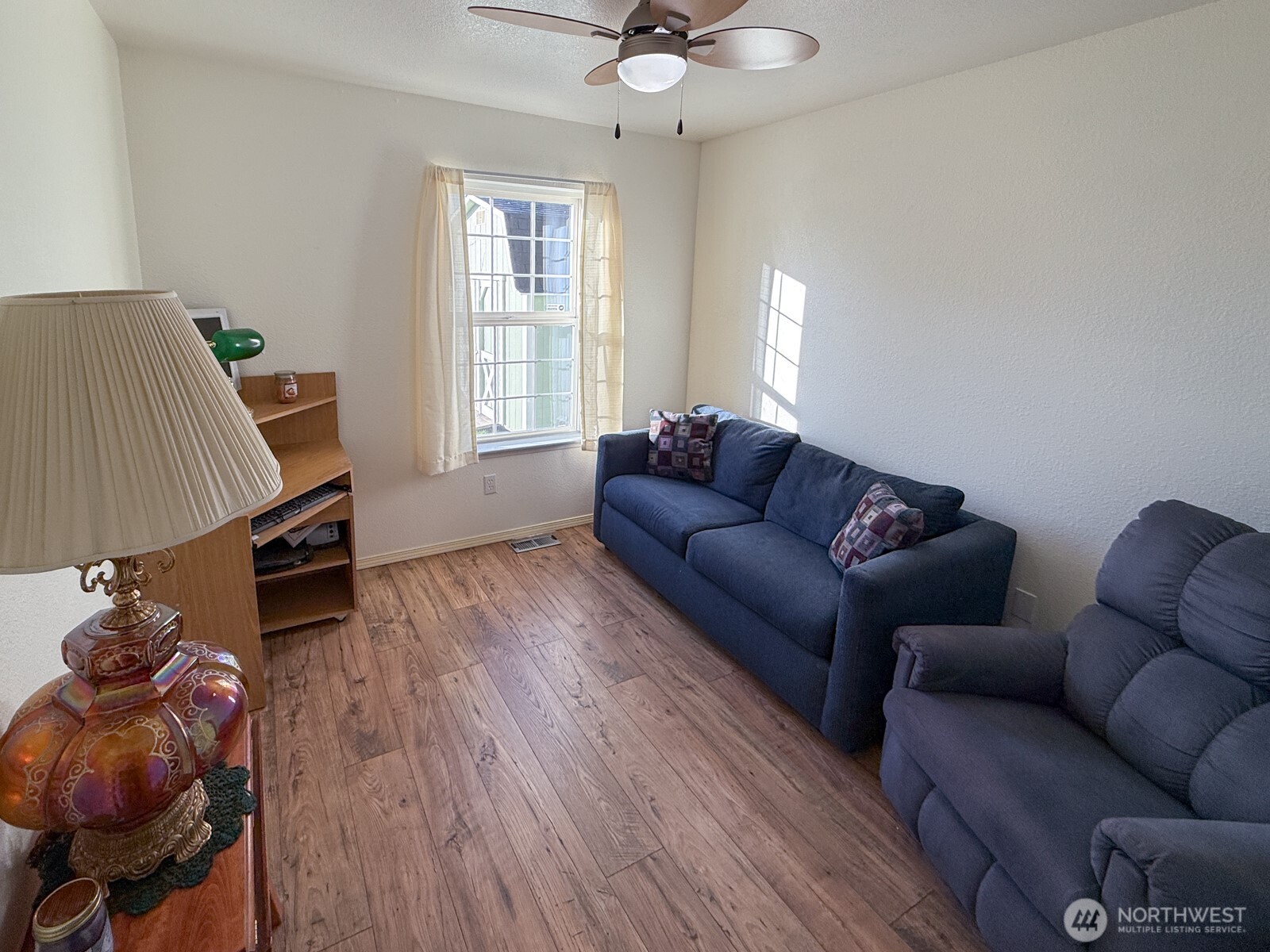 823 Southwest 21st Street Chehalis, WA 98532 - Photo 22 of 38 a living room with furniture and a window