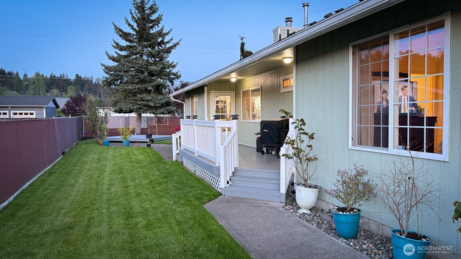 823 Southwest 21st Street Chehalis, WA 98532 - Photo 8 of 38 a front view of a house with a garden and sitting area