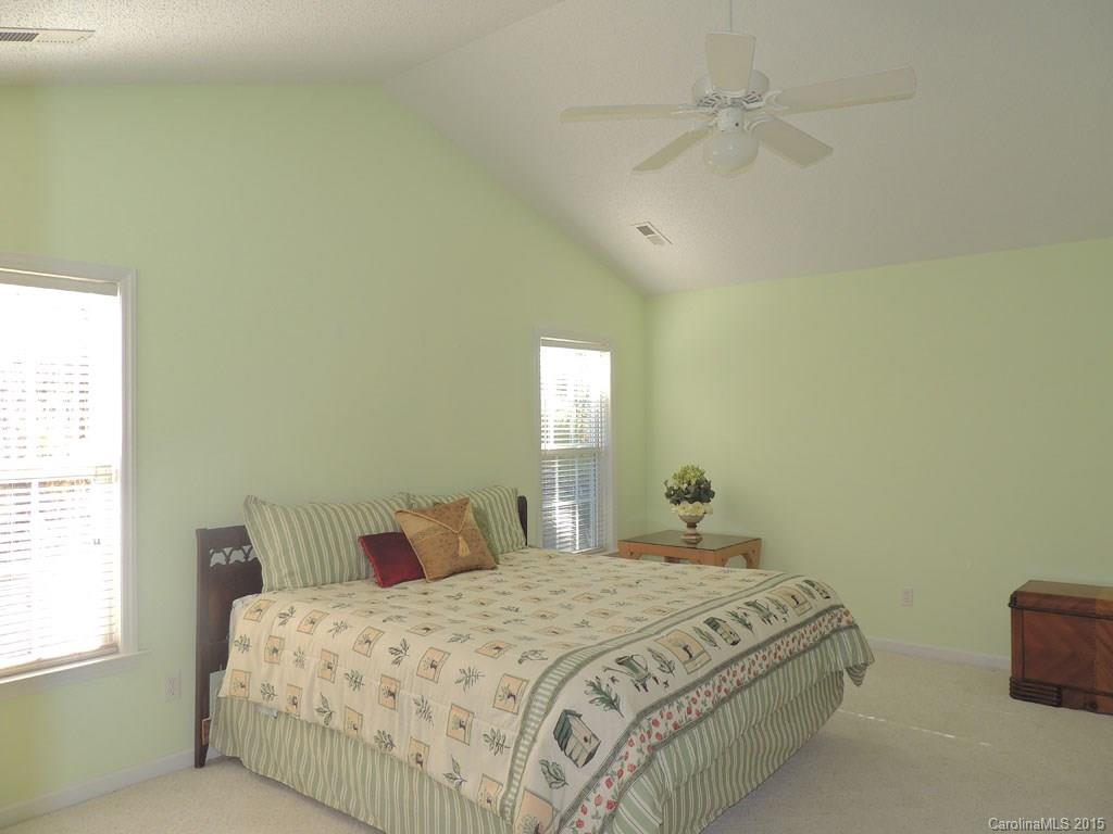 112 Forest Berry Road Fletcher, NC 28732 - Photo 14 of 21 a bedroom with a bed and a window