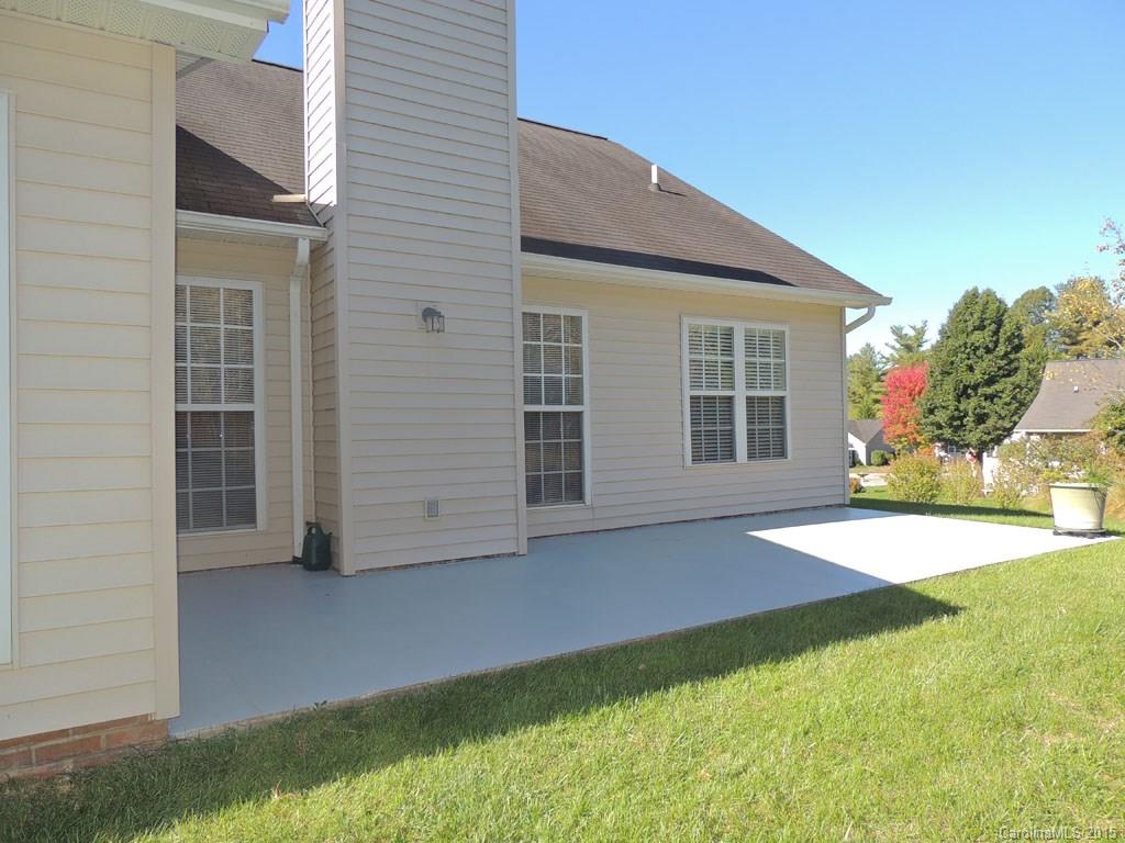 112 Forest Berry Road Fletcher, NC 28732 - Photo 17 of 21 a view of a house with backyard and a garage