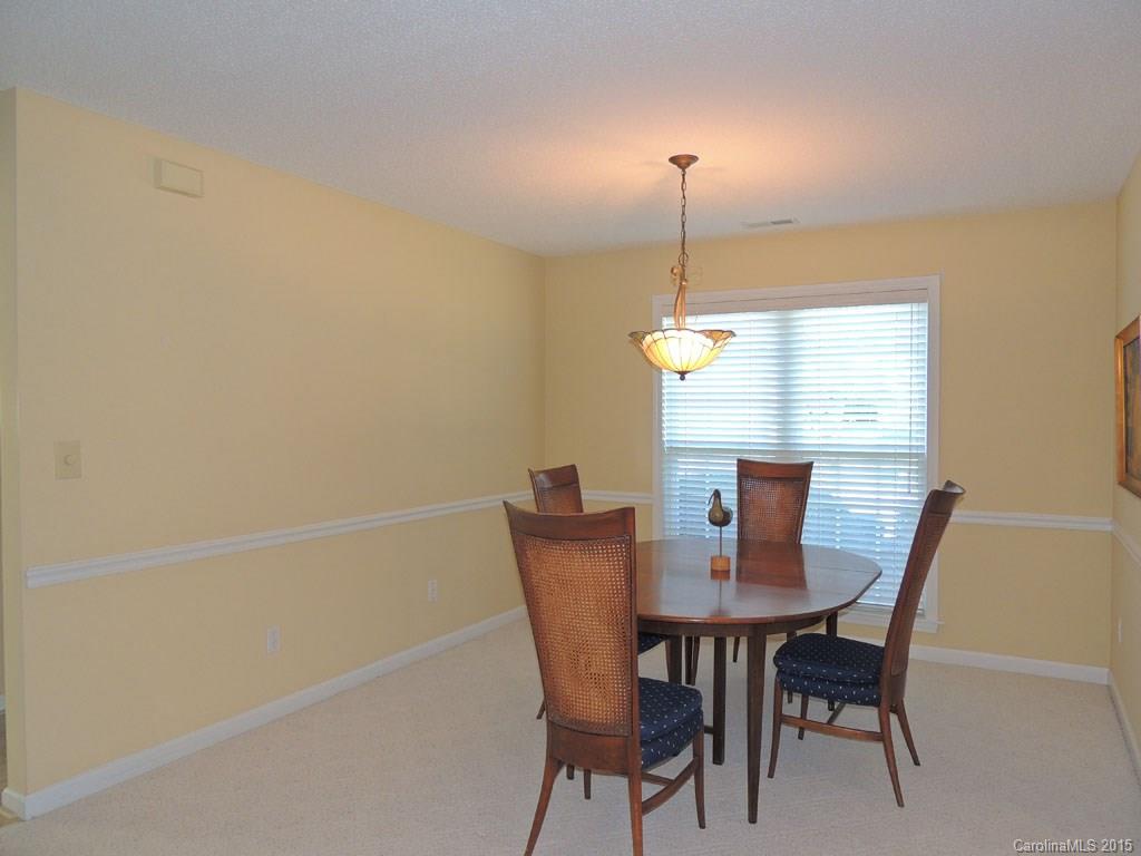 112 Forest Berry Road Fletcher, NC 28732 - Photo 3 of 21 a view of a dining room with furniture window and wooden floor