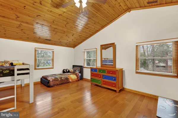 a bedroom with furniture and window