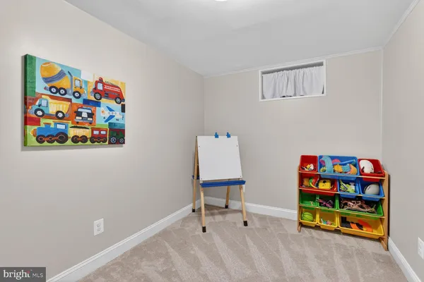 a room with toys and painting on the wall