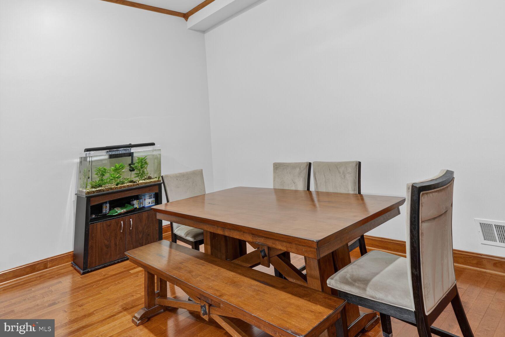 4406 Roundhill Road Alexandria, VA 22310 - Photo 7 of 48 a living room with furniture and wooden floor