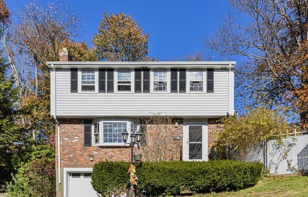 30 Pinewood Road Canton, MA 02021 - Photo 1 of 23 a front view of a house with garden