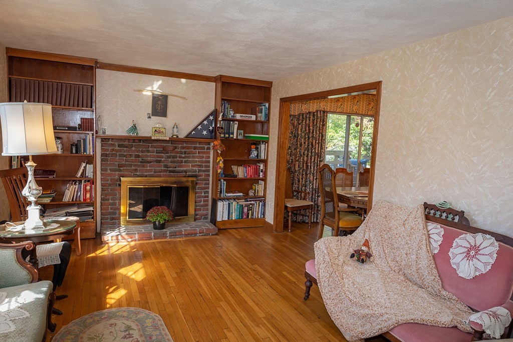 30 Pinewood Road Canton, MA 02021 - Photo 11 of 23 a living room with furniture and a fireplace