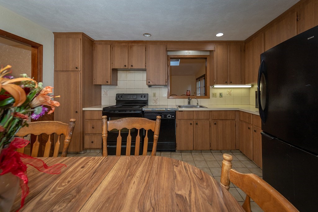 30 Pinewood Road Canton, MA 02021 - Photo 15 of 23 a kitchen with stainless steel appliances a refrigerator and a stove top oven