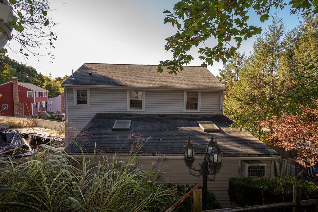 30 Pinewood Road Canton, MA 02021 - Photo 5 of 23 a front view of a house with a yard