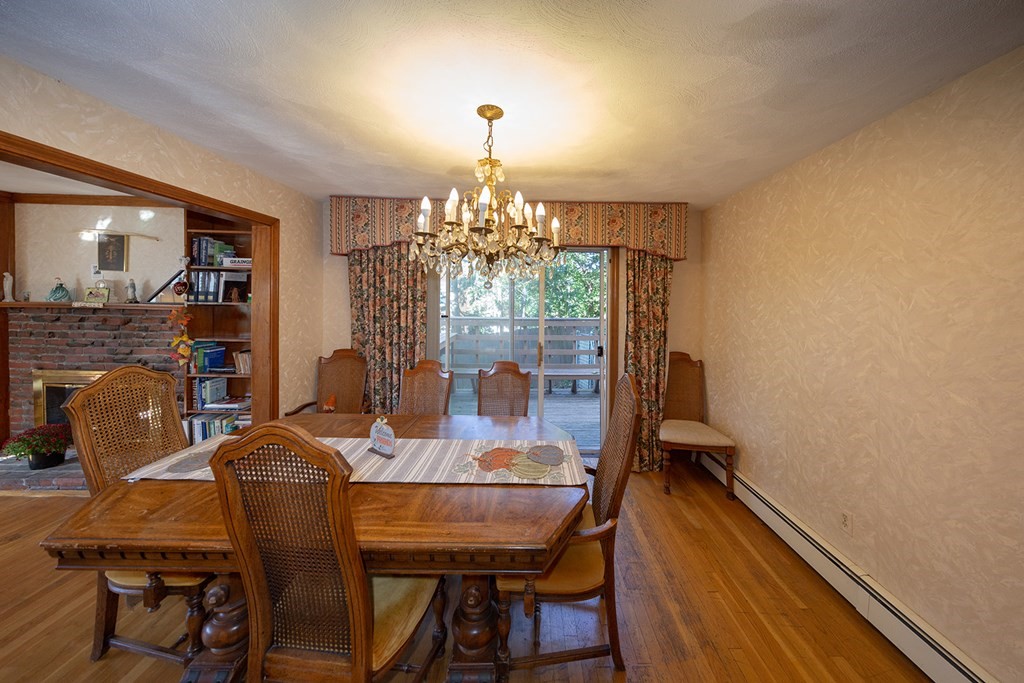 30 Pinewood Road Canton, MA 02021 - Photo 7 of 23 a view of a dining room with furniture and chandelier