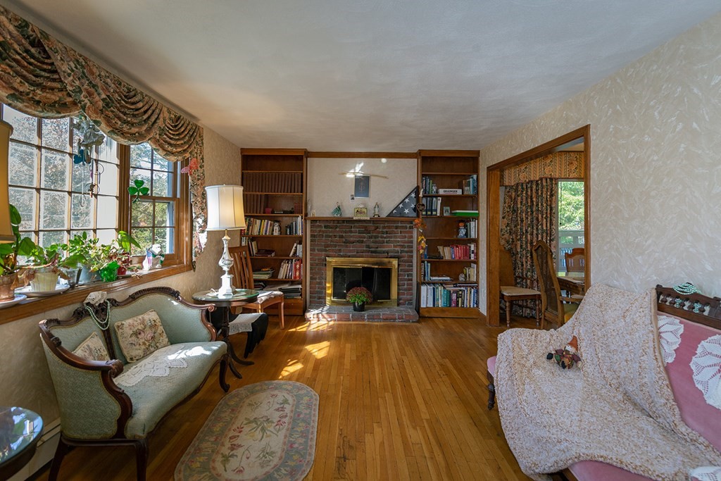 30 Pinewood Road Canton, MA 02021 - Photo 10 of 23 a living room with furniture large window and a fireplace