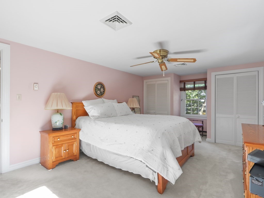 37 Richdale Road Needham, MA 02494 - Photo 13 of 23 a bedroom with a bed and a chandelier