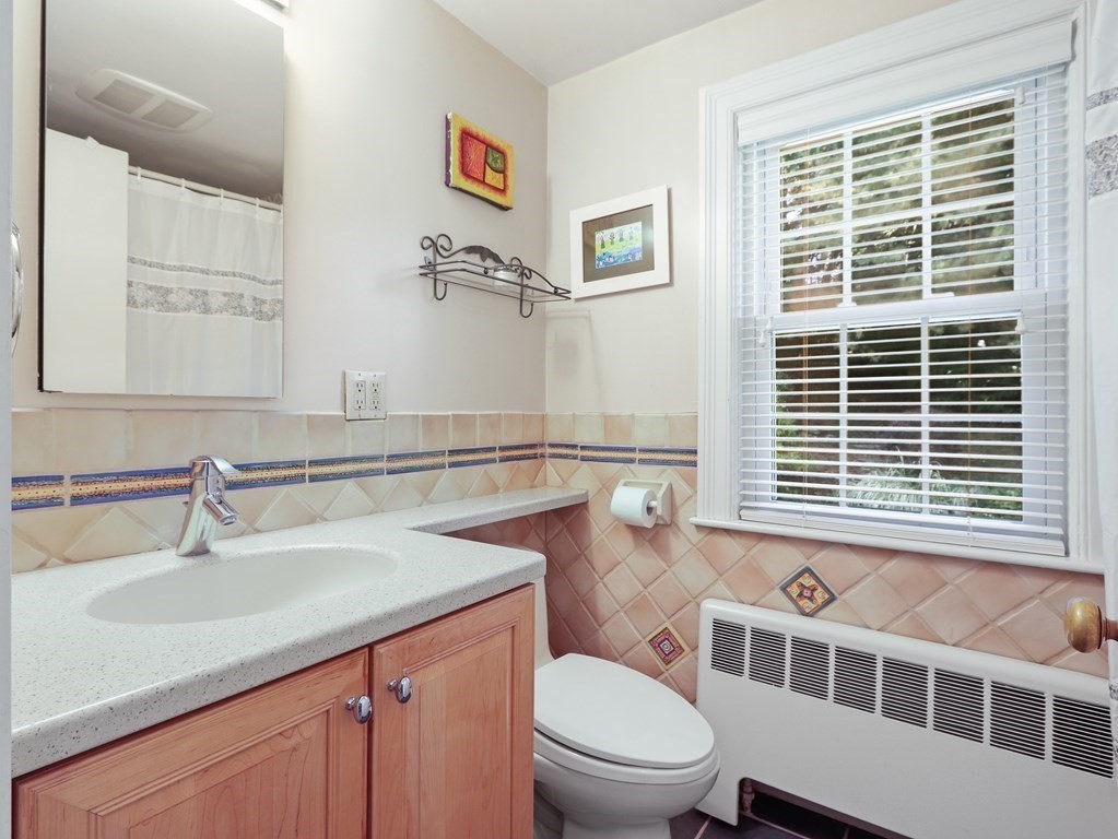 37 Richdale Road Needham, MA 02494 - Photo 15 of 23 a bathroom with a sink a toilet a window and shower