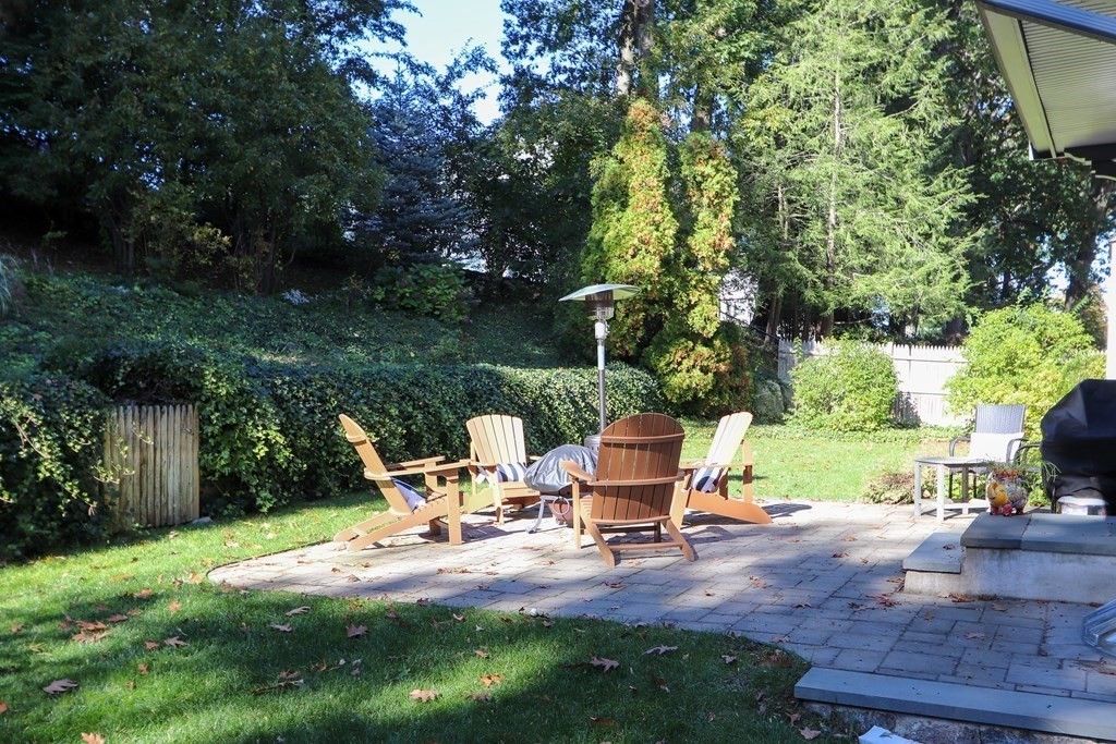 37 Richdale Road Needham, MA 02494 - Photo 21 of 23 a backyard of a house with table and chairs