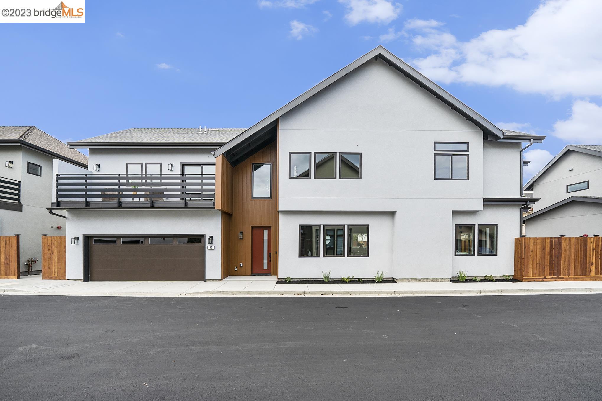 20 London Lane Rodeo, CA 94572 - Photo 1 of 1 a front view of a house with a yard and garage