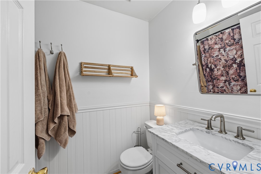 1200 Abingdon Road North Chesterfield, VA 23236 - Photo 16 of 26 Bathroom featuring a white vanity with a stone cou