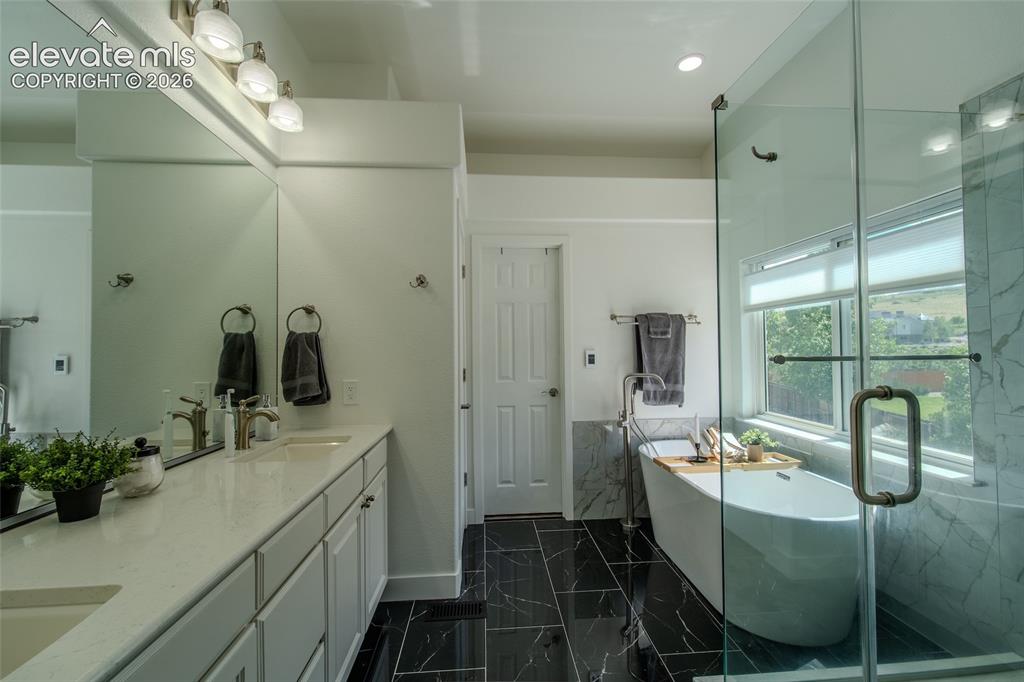 789 Capeglen Road Colorado Springs, CO 80906 - Photo 28 of 46 Private water closet with large walk in closet