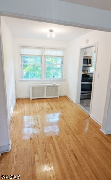 44 Meadowbrook Place Maplewood, NJ 07040 - Photo 6 of 7 an empty room with wooden floor and windows