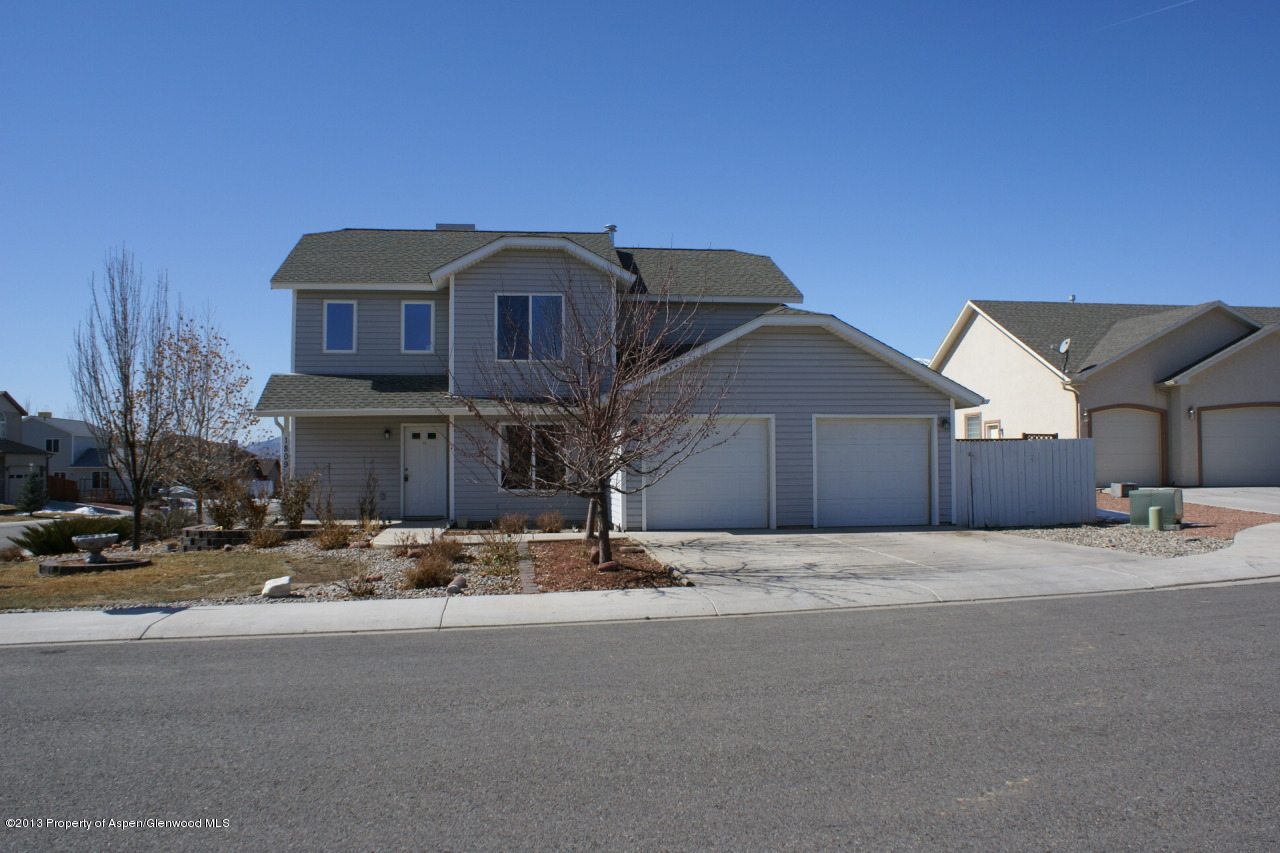 1809 Anvil Court Rifle, CO 81650 - Photo 1 of 11 a street view with wooden fence