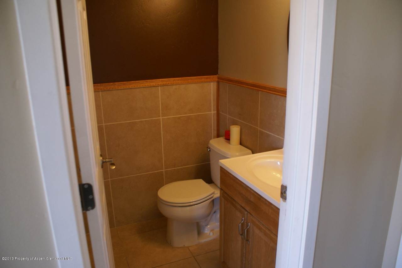 1809 Anvil Court Rifle, CO 81650 - Photo 5 of 11 a bathroom with a toilet and a shower