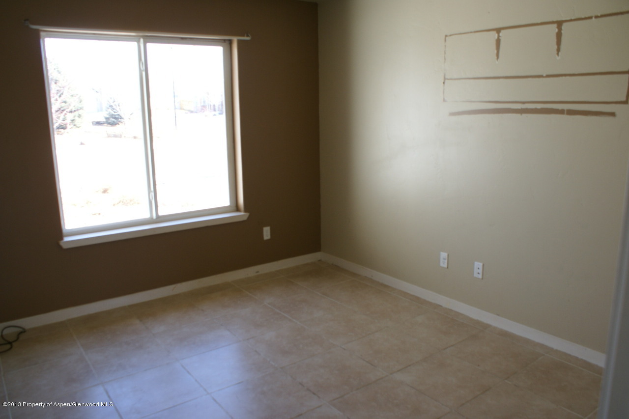 1809 Anvil Court Rifle, CO 81650 - Photo 6 of 11 an empty room with a window