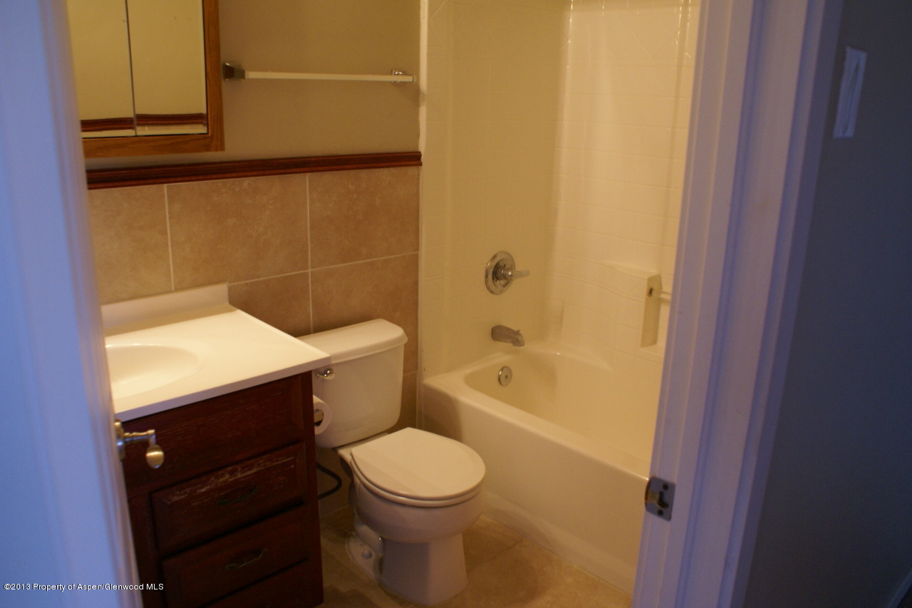 1809 Anvil Court Rifle, CO 81650 - Photo 7 of 11 a bathroom with a sink a toilet and shower