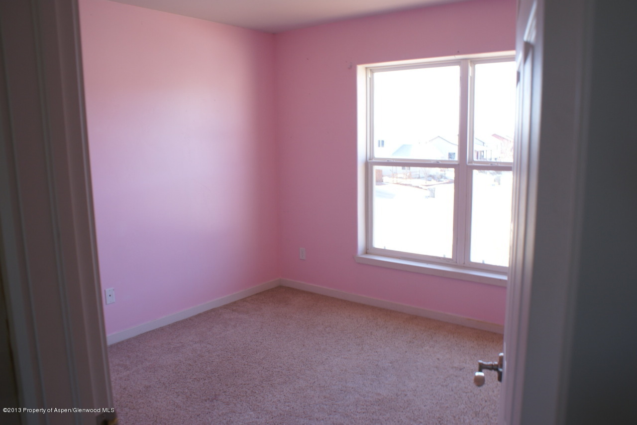1809 Anvil Court Rifle, CO 81650 - Photo 8 of 11 an empty room with a window