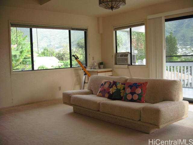 3017 Manoa Road, Unit 3017 Honolulu, HI 96822 - Photo 1 of 1 a living room with furniture and a large window
