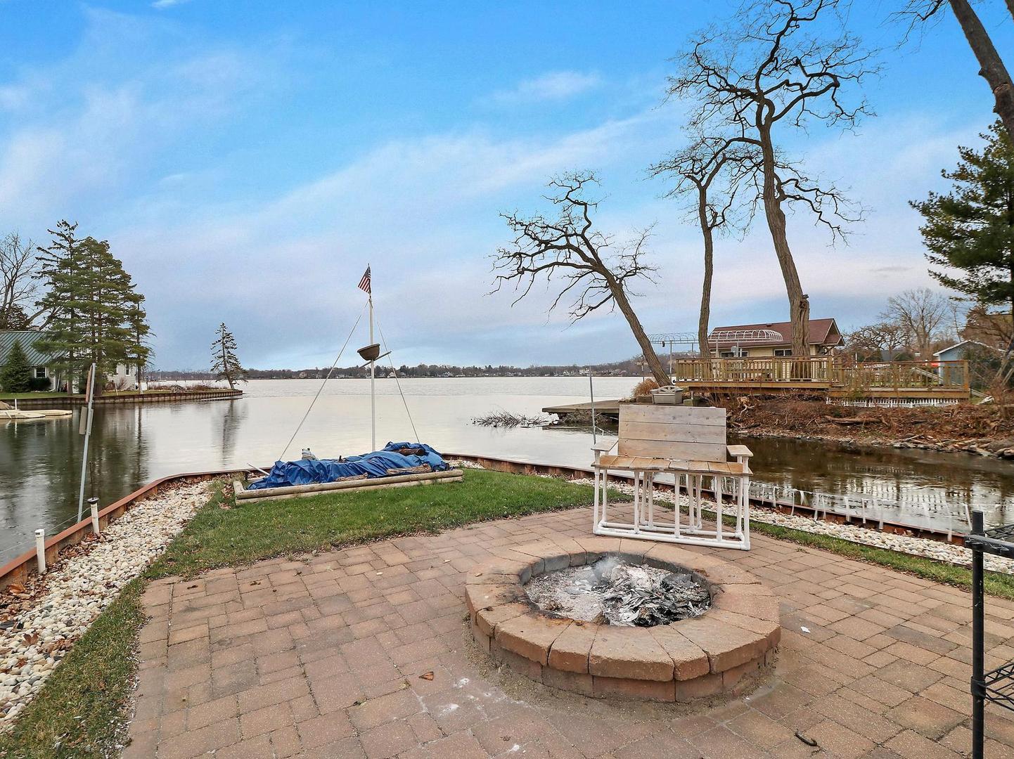 35409 North Wilson Road Ingleside, IL 60041 - Photo 29 of 36 a swimming pool with barbeque oven in front of it