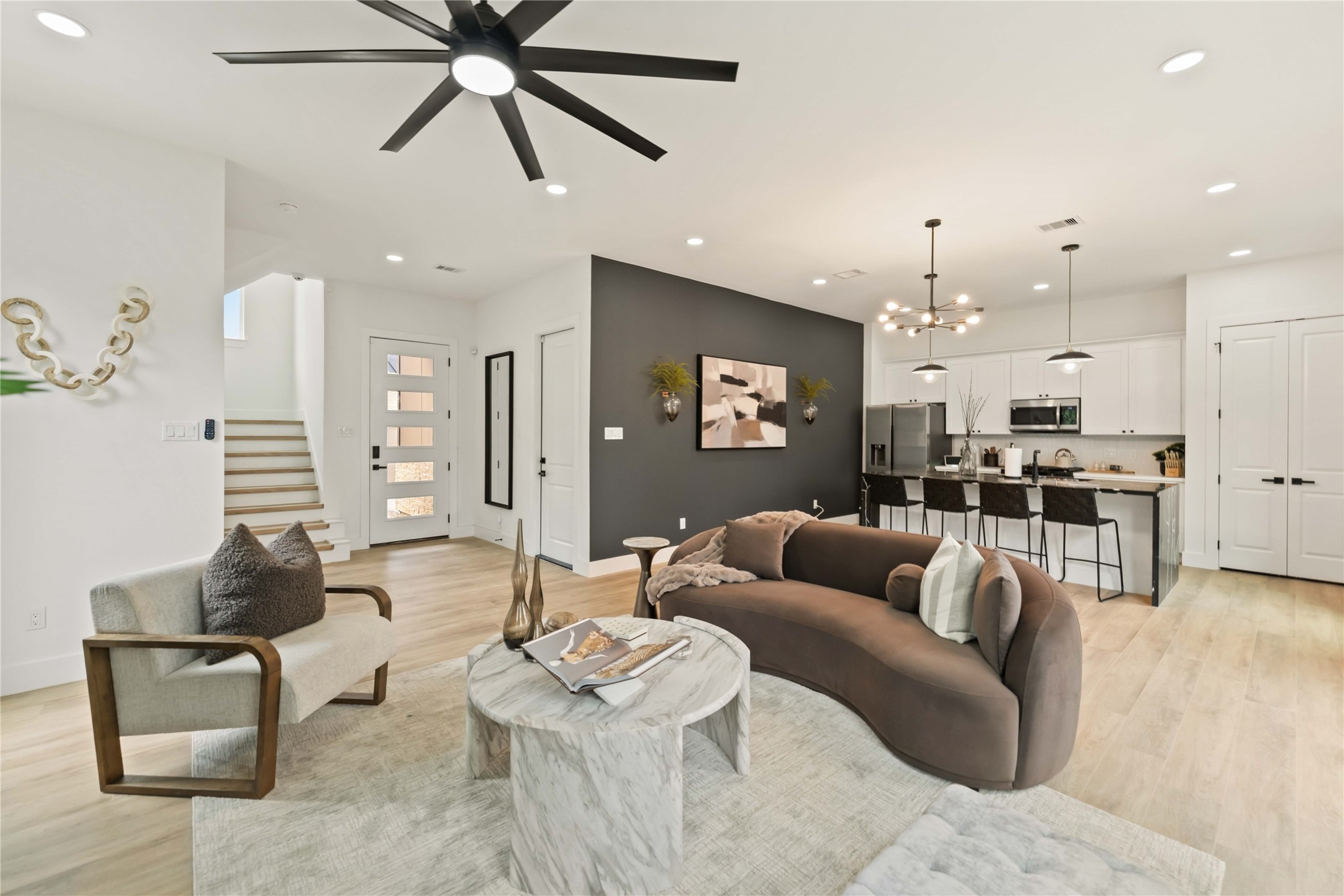 6539 Sealey Street Houston, TX 77091 - Photo 9 of 28 a living room with furniture kitchen view and a chandelier