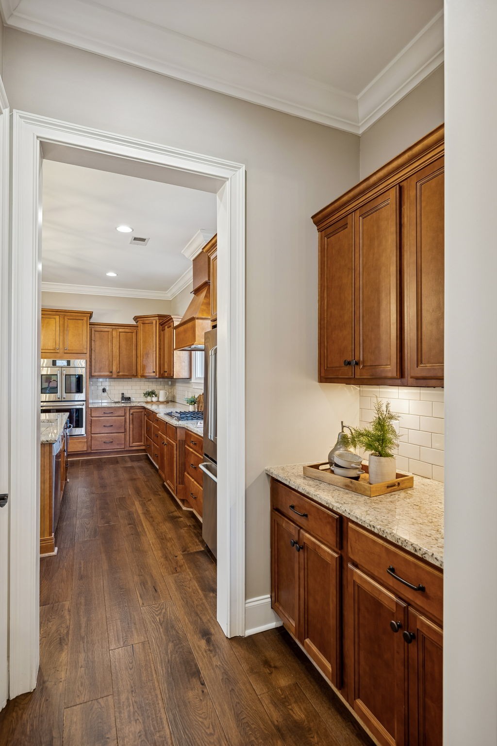 2525 Upper Hollow Road Thompson's Station, TN 37179 - Photo 12 of 79 a view of a kitchen center island cabinets and wooden floor