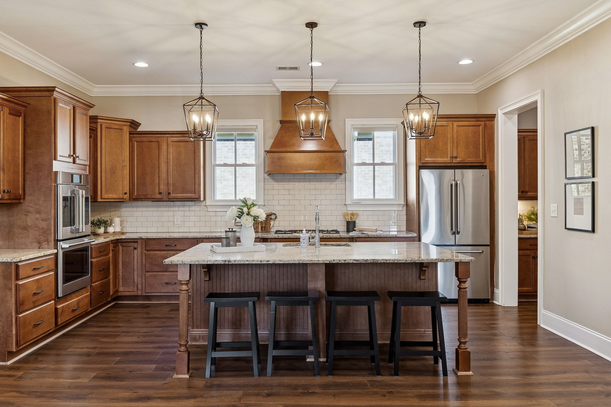 2525 Upper Hollow Road Thompson's Station, TN 37179 - Photo 40 of 79 a kitchen with stainless steel appliances granite countertop a kitchen island hardwood floor and a sink