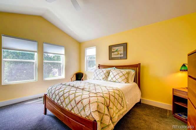 810 East Baseline Road, Unit B Lafayette, CO 80026 - Photo 16 of 28 a large bed sitting in a bedroom next to a window
