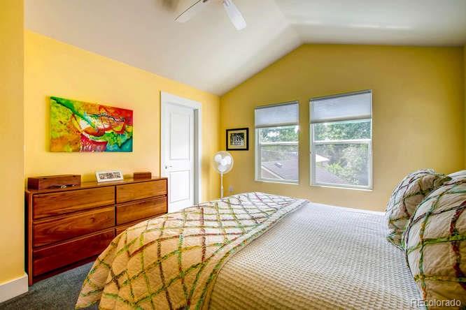 810 East Baseline Road, Unit B Lafayette, CO 80026 - Photo 19 of 28 a spacious bedroom with a bed and wooden floor