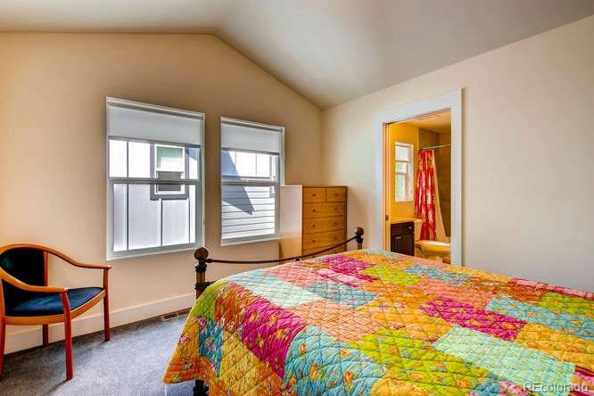 810 East Baseline Road, Unit B Lafayette, CO 80026 - Photo 21 of 28 a bedroom with a bed and a window