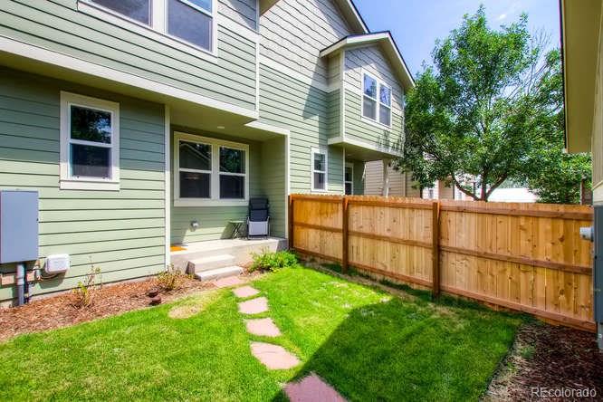 810 East Baseline Road, Unit B Lafayette, CO 80026 - Photo 28 of 28 a view of a house with a yard and sitting area