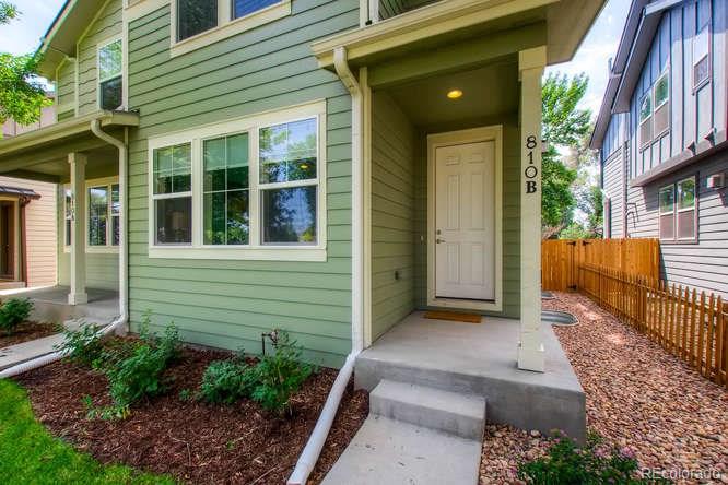 810 East Baseline Road, Unit B Lafayette, CO 80026 - Photo 3 of 28 a view of a house with a garden