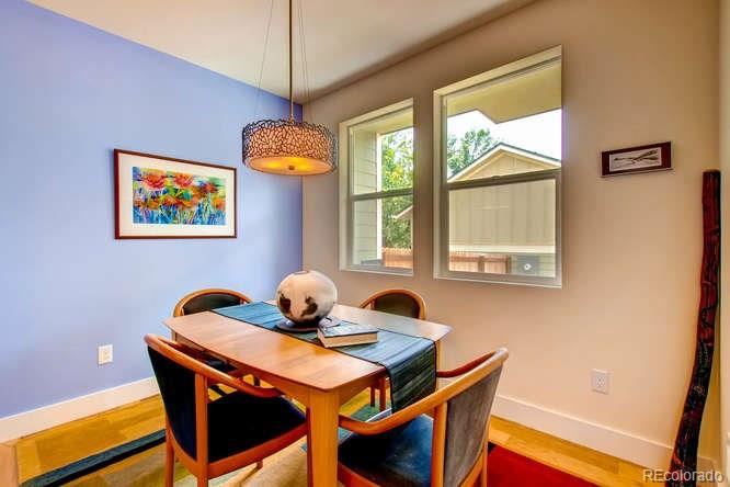 810 East Baseline Road, Unit B Lafayette, CO 80026 - Photo 7 of 28 a dining room with a table and chairs