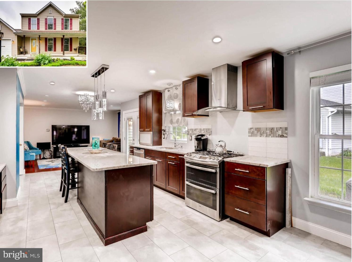 403 North Hammonds Ferry Road Linthicum, MD 21090 - Photo 1 of 30 a kitchen with stainless steel appliances granite countertop a sink and a stove