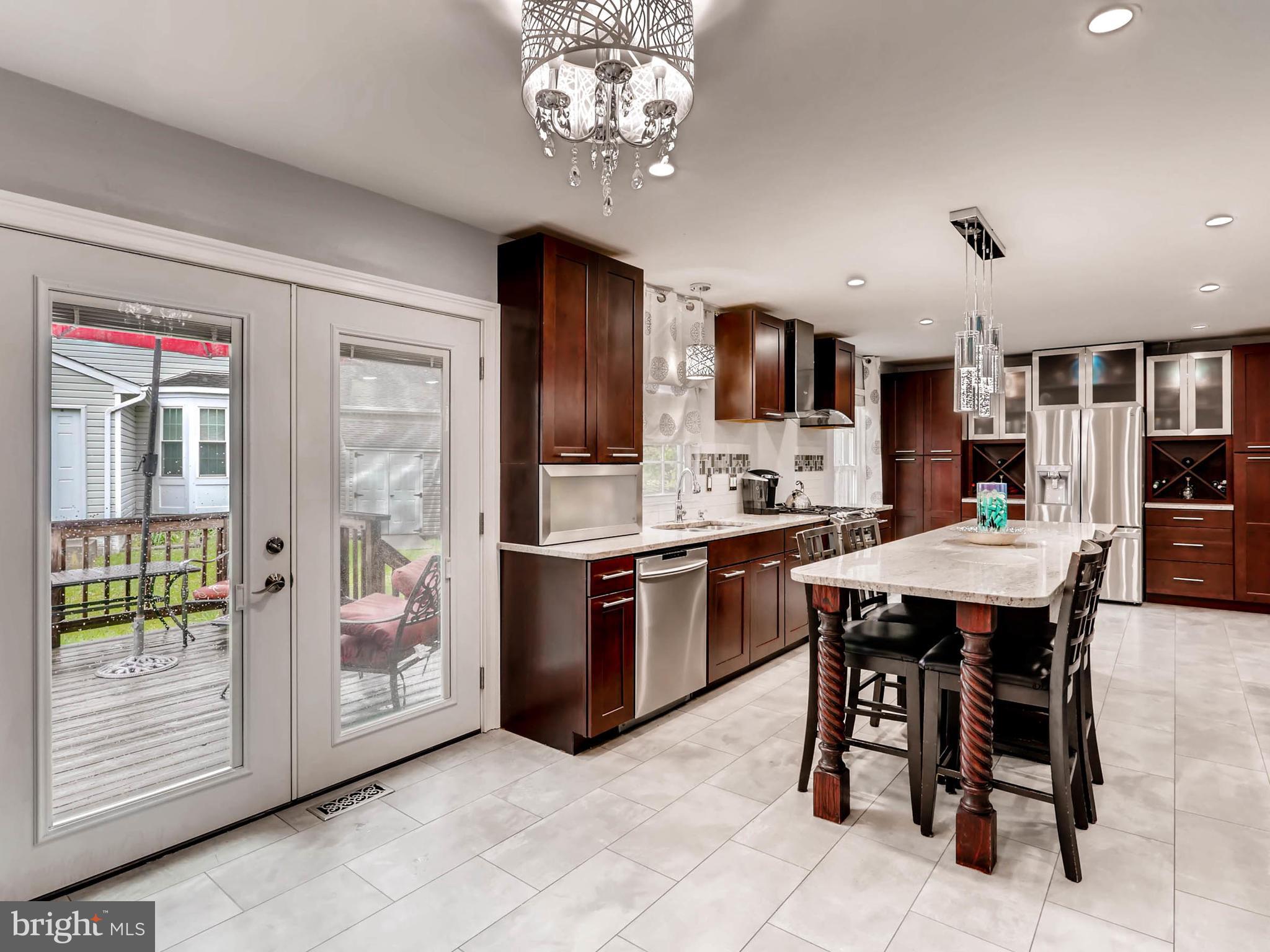 403 North Hammonds Ferry Road Linthicum, MD 21090 - Photo 12 of 30 a kitchen with a table and chairs in it