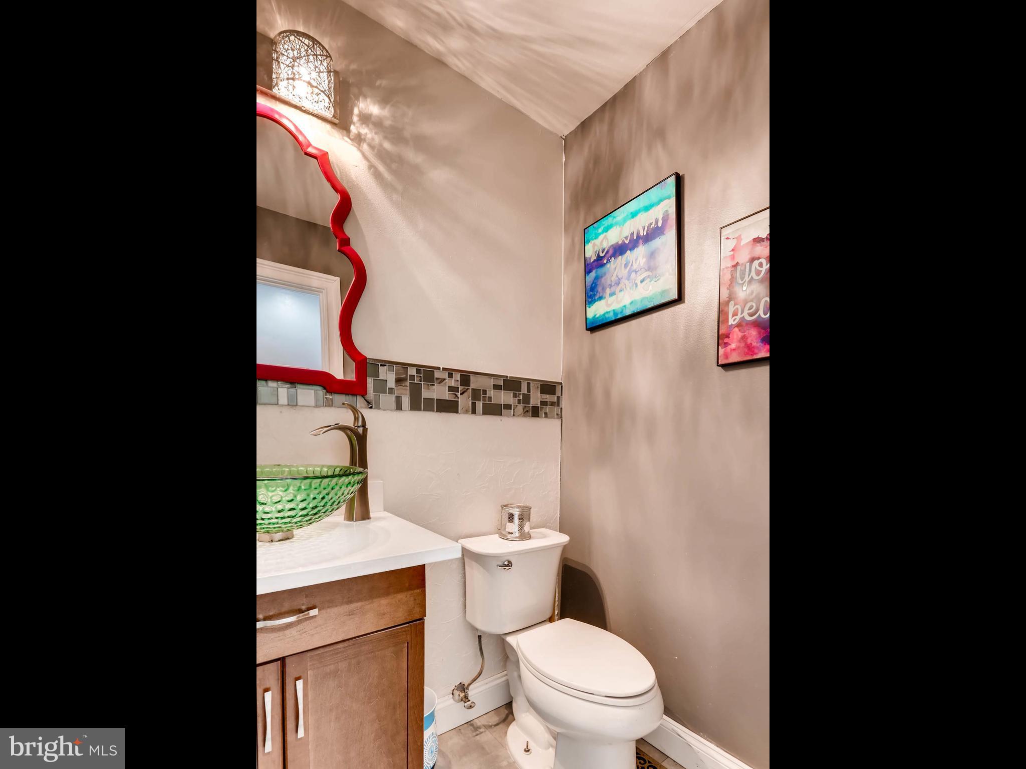 403 North Hammonds Ferry Road Linthicum, MD 21090 - Photo 14 of 30 a bathroom with a toilet and a shower