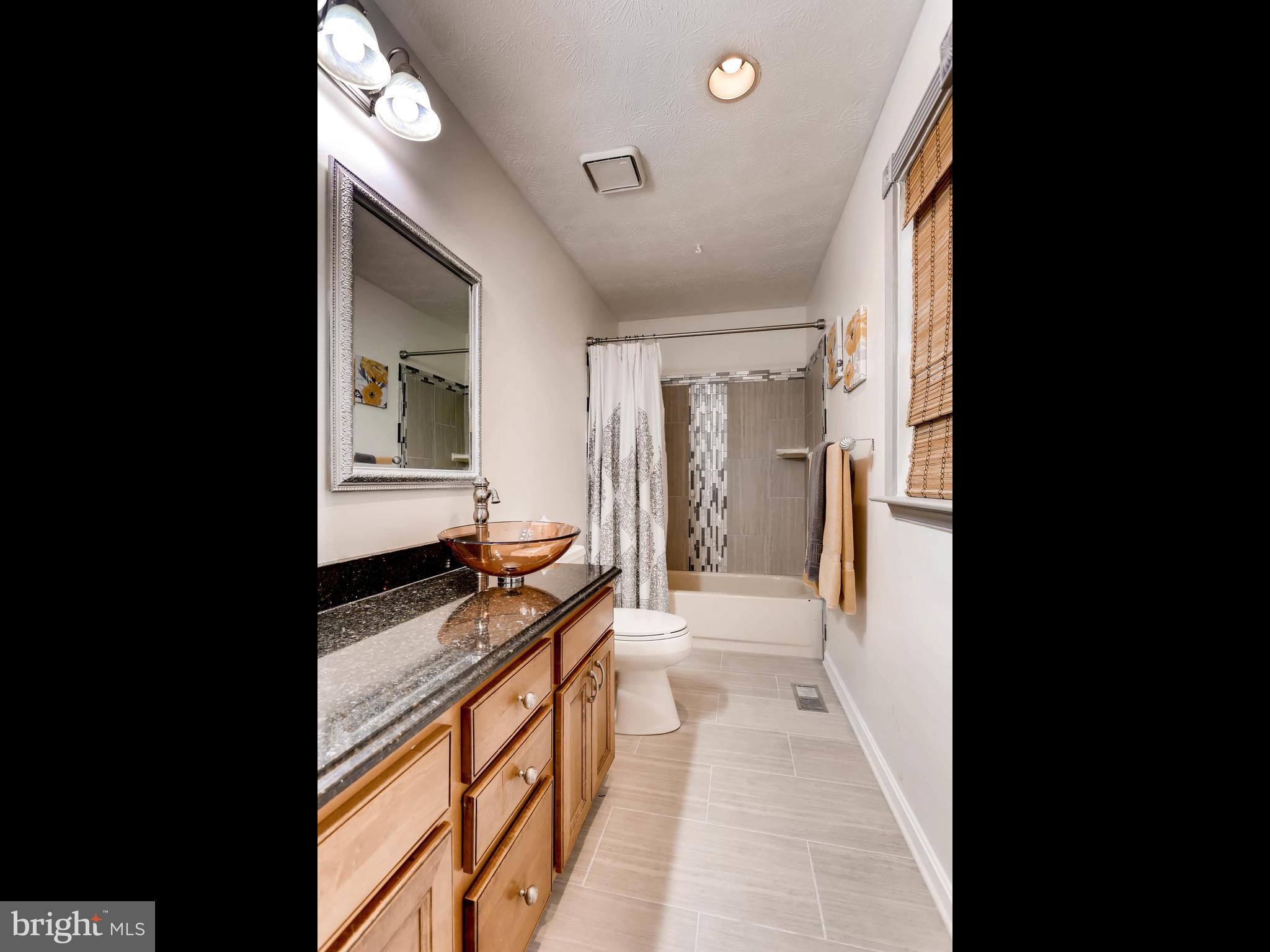 403 North Hammonds Ferry Road Linthicum, MD 21090 - Photo 17 of 30 a view of a kitchen with a sink and cabinets