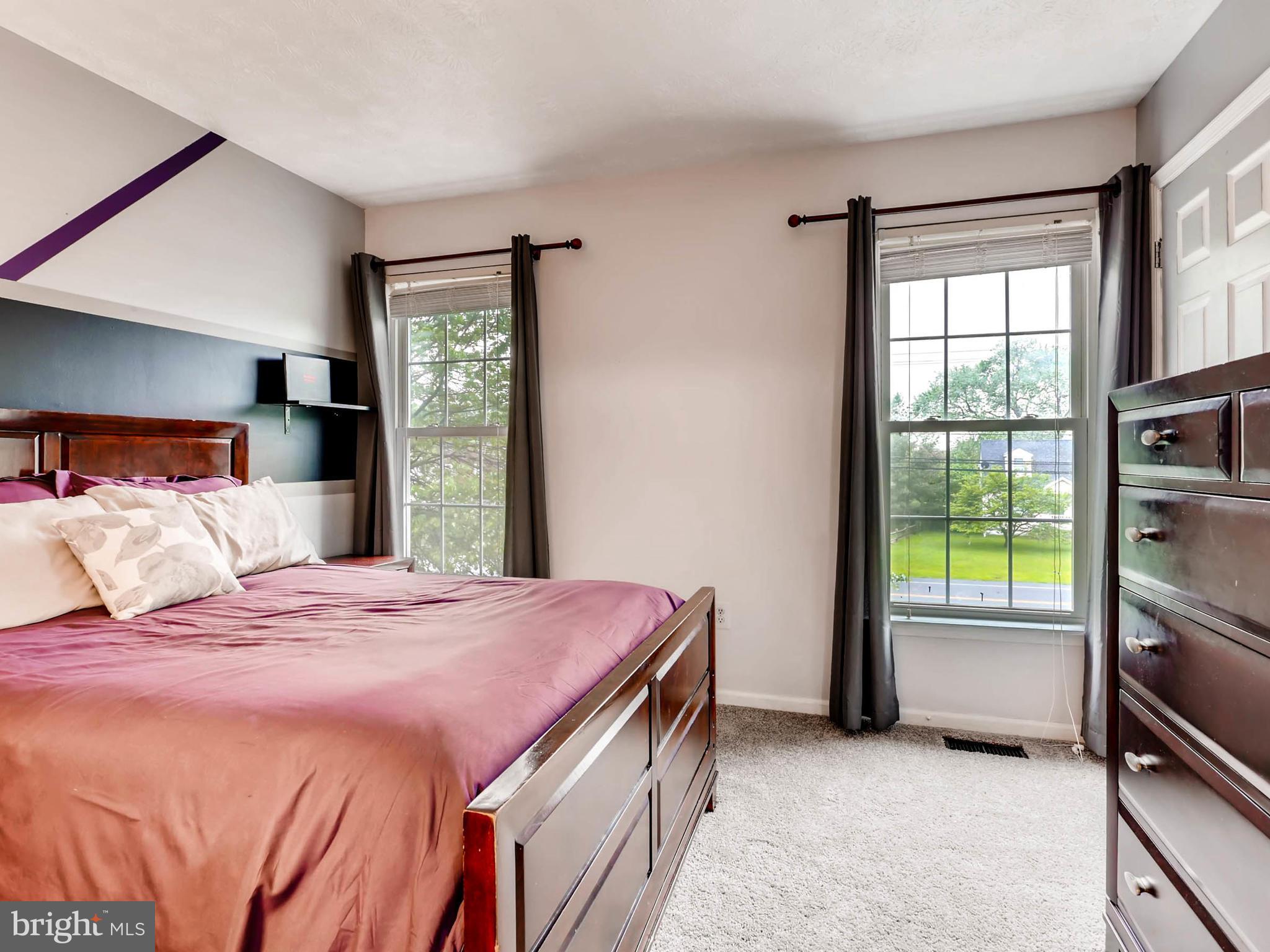 403 North Hammonds Ferry Road Linthicum, MD 21090 - Photo 18 of 30 a bedroom with a bed and a window