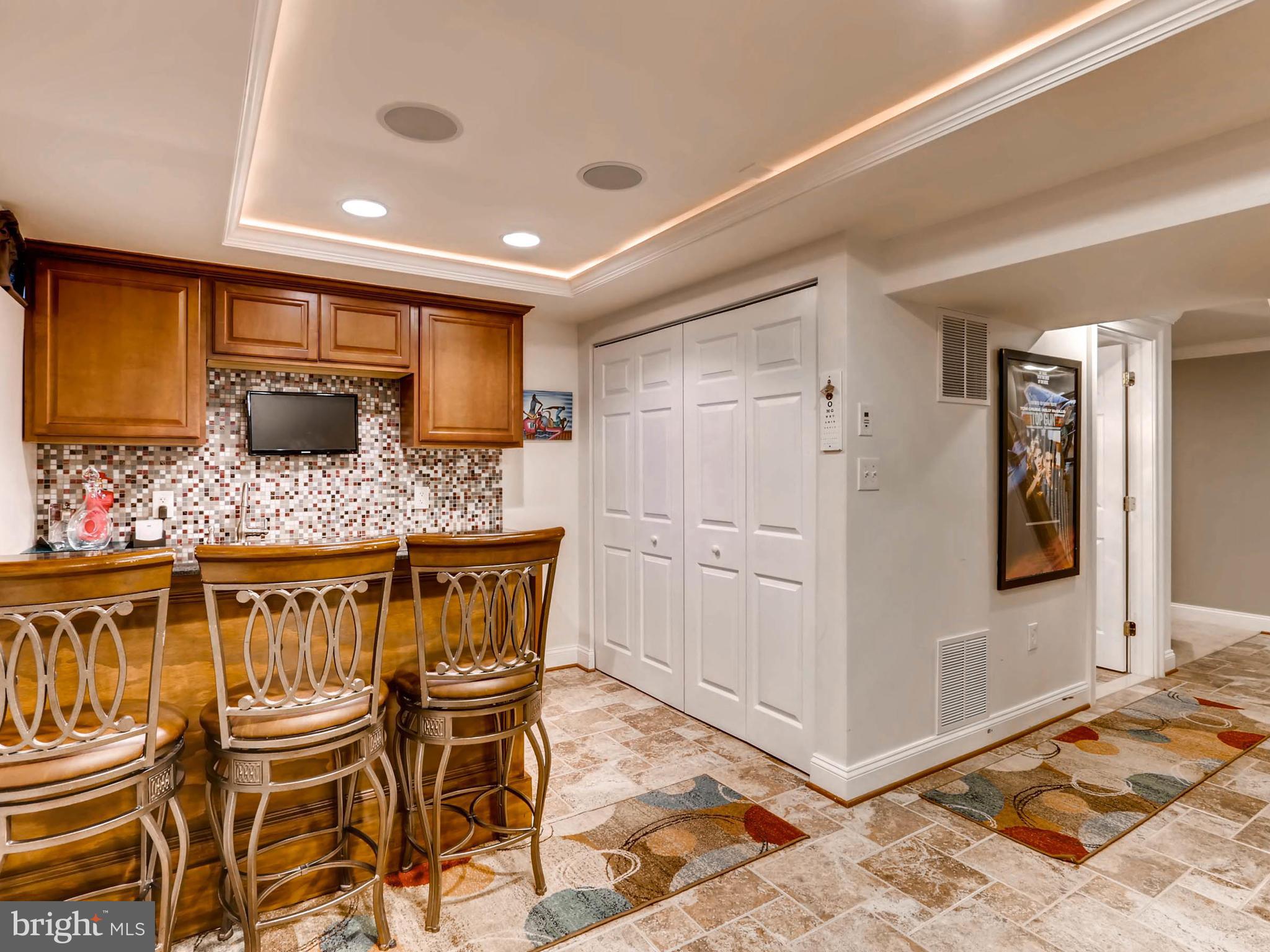 403 North Hammonds Ferry Road Linthicum, MD 21090 - Photo 22 of 30 a kitchen with stainless steel appliances kitchen island granite countertop a table and chairs