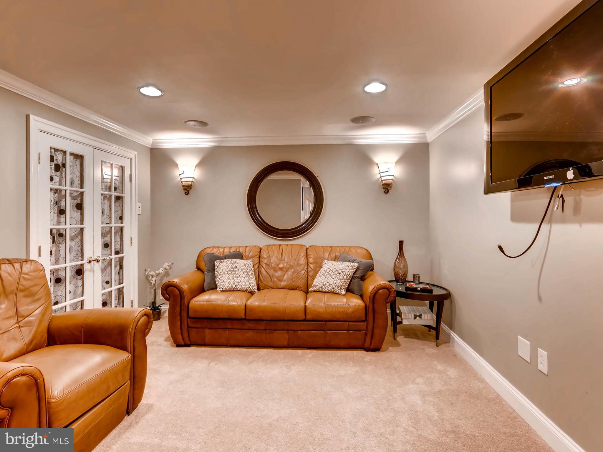 403 North Hammonds Ferry Road Linthicum, MD 21090 - Photo 25 of 30 a living room with furniture and a flat screen tv