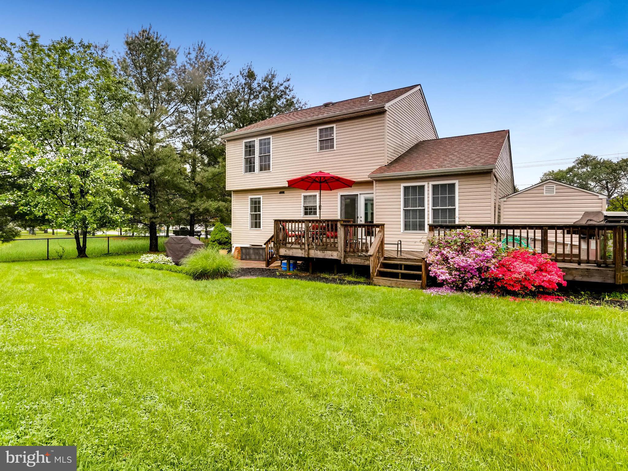 403 North Hammonds Ferry Road Linthicum, MD 21090 - Photo 30 of 30 a view of a house with a big yard and large trees