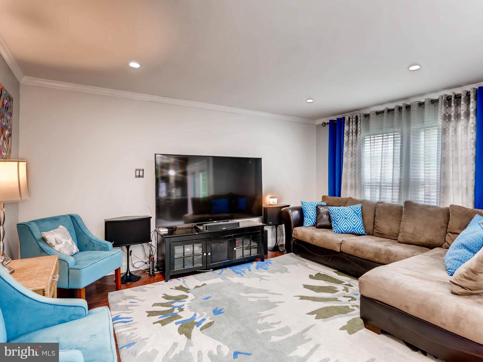 403 North Hammonds Ferry Road Linthicum, MD 21090 - Photo 5 of 30 a living room with furniture and a flat screen tv