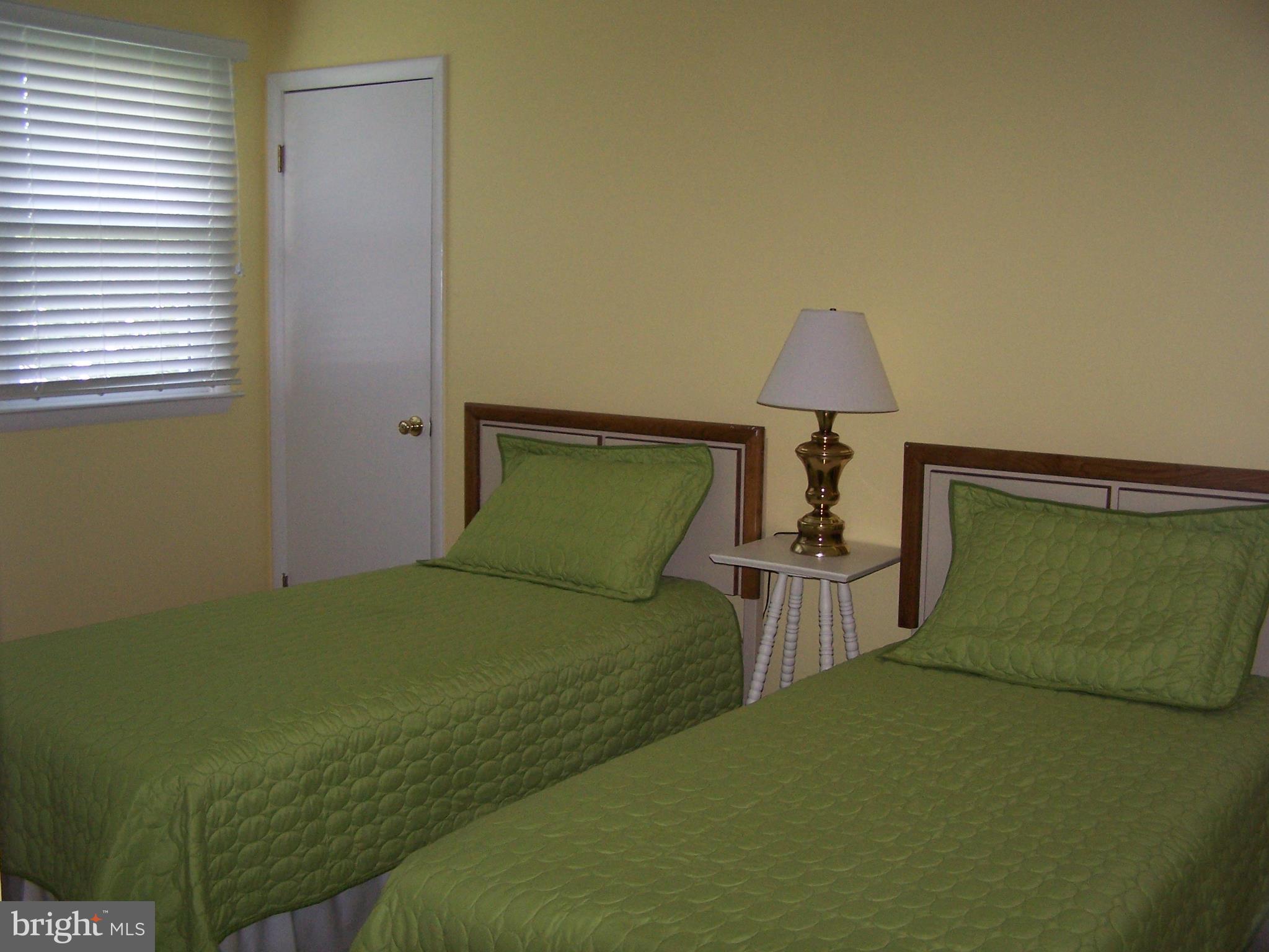 1402 Cedar Street Lewes, DE 19958 - Photo 5 of 6 a bedroom with a bed and a window