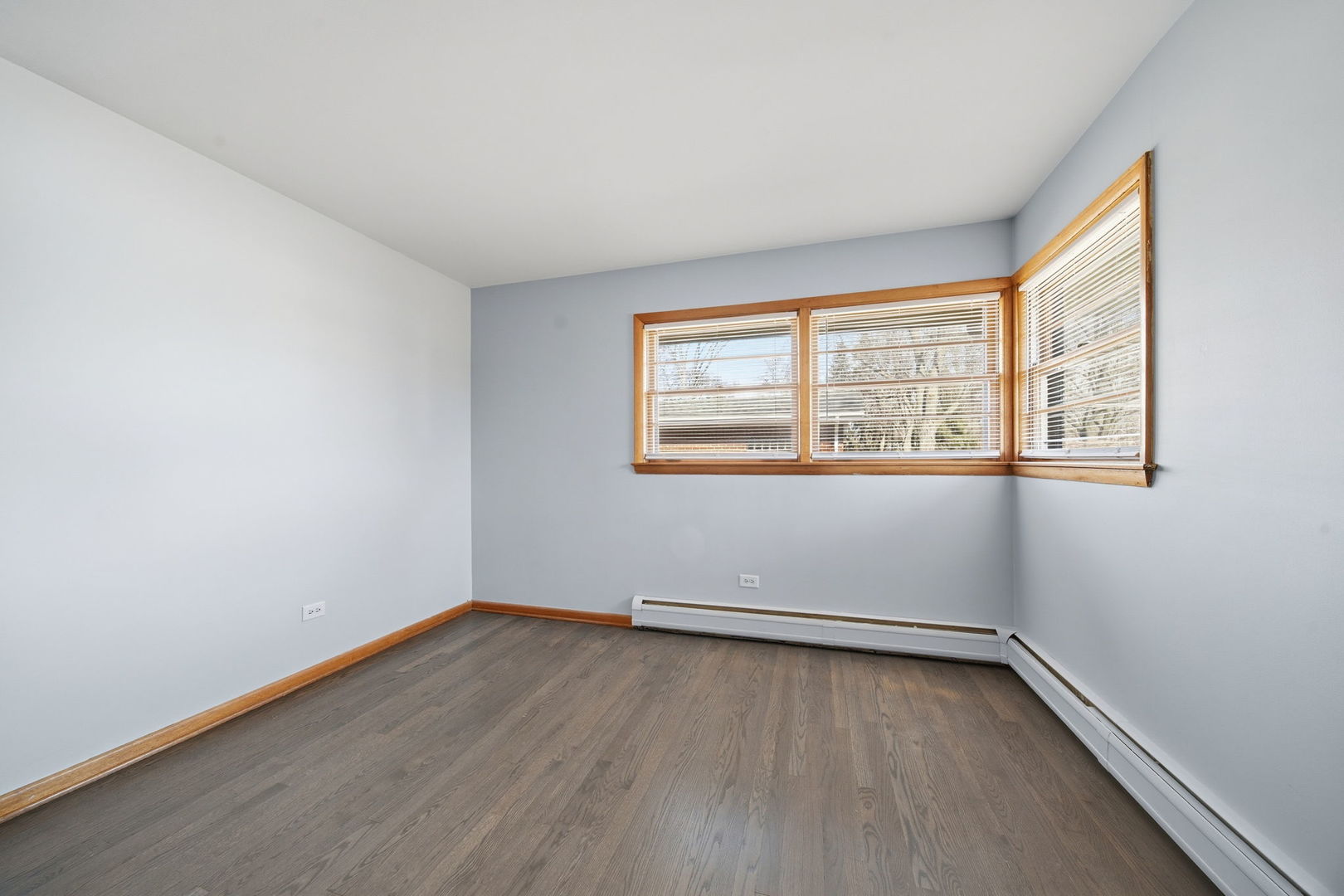 14601 Linder Avenue Midlothian, IL 60445 - Photo 13 of 21 an empty room with wooden floor and windows